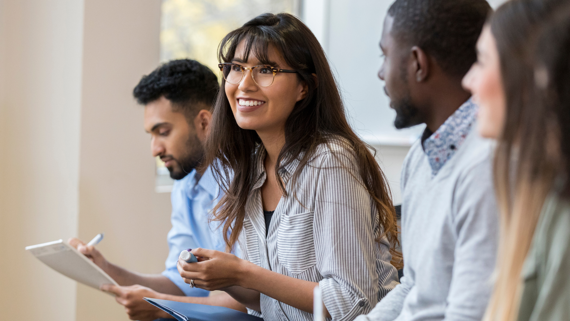 Group of young professionals engaged in discussion—representing collaboration, early career development, and inclusive consultancy talent Group of young professionals engaged in discussion—representing collaboration, early career development, and inclusive consultancy talent