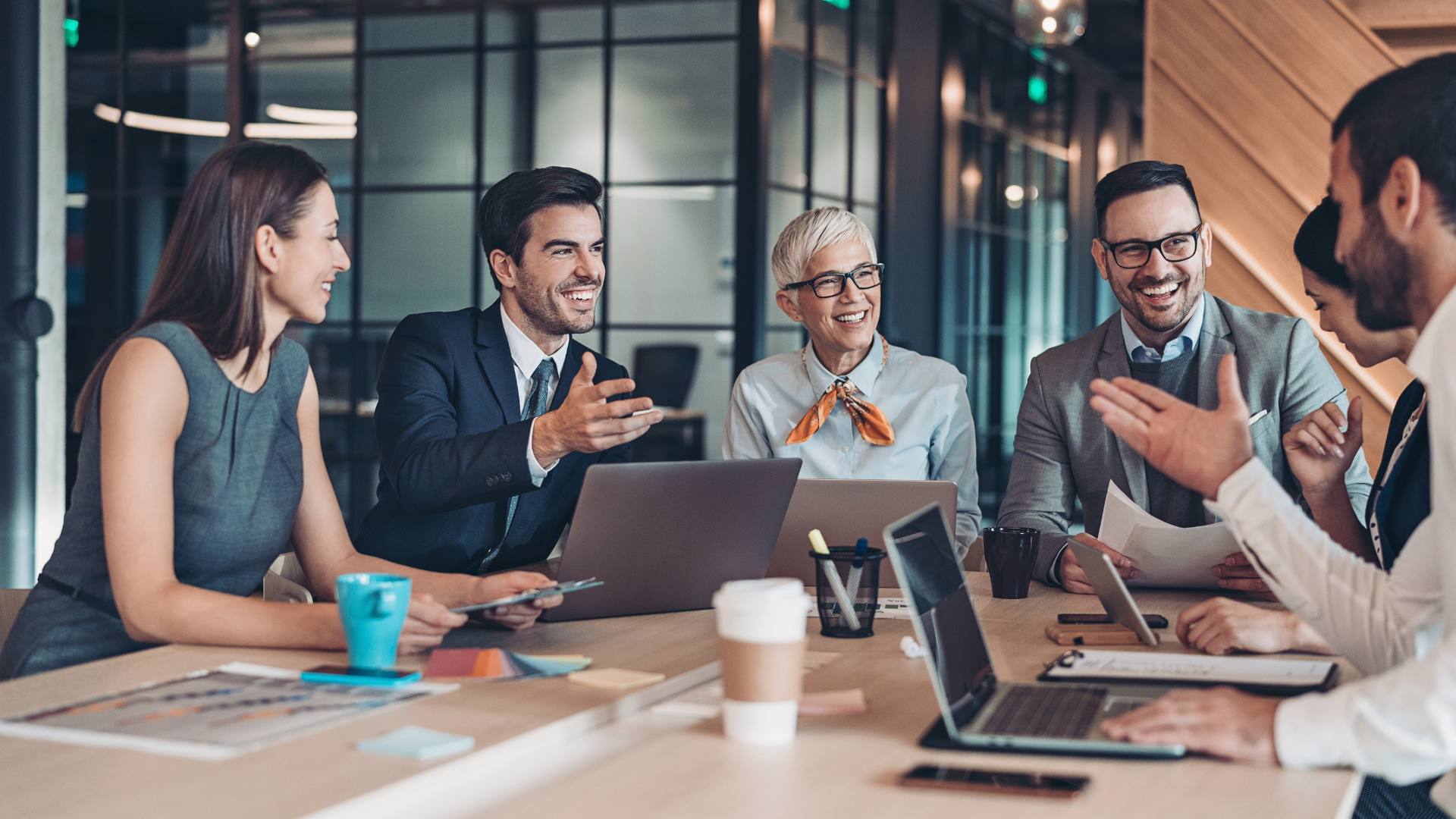 Professional team in a collaborative meeting, reviewing documents and strategy—representing trusted delivery through public sector frameworks Professional team in a collaborative meeting, reviewing documents and strategy—representing trusted delivery through public sector frameworks